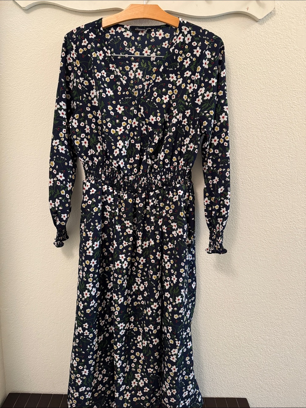 BloomChic Navy Maxi Dress with White Floral and Green Leaf Accents